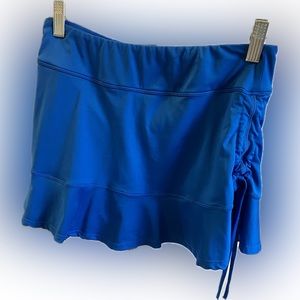 Pickleball/tennis skirt. FILA ladies L. Runs small.  Blue w/yellow. NWT.